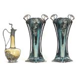 three pieces of WMF marked Art Nouveau : a small decanter and a pair of vases with whiplash