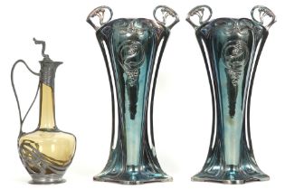 three pieces of WMF marked Art Nouveau : a small decanter and a pair of vases with whiplash