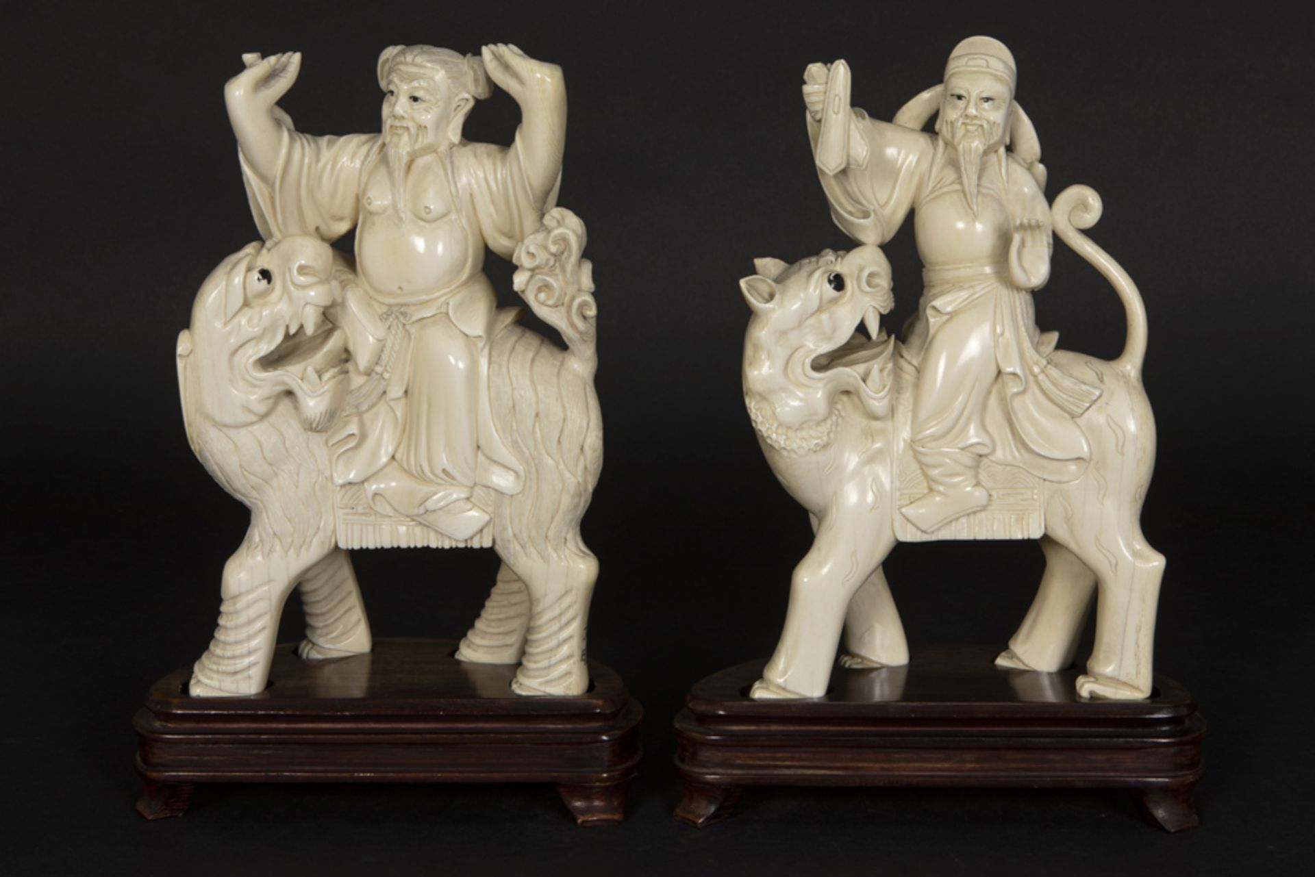pair of antique Chinese late Qing period sculptures in finely carved ivory with a nice patina and