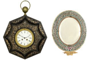 antique wall clock (with marked and dated work) and an oval mirror with its frame in metal and micro