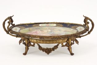 oval dish in Sèvres marked porcelain with paintings, signed Rochette, and with mounting in gilded