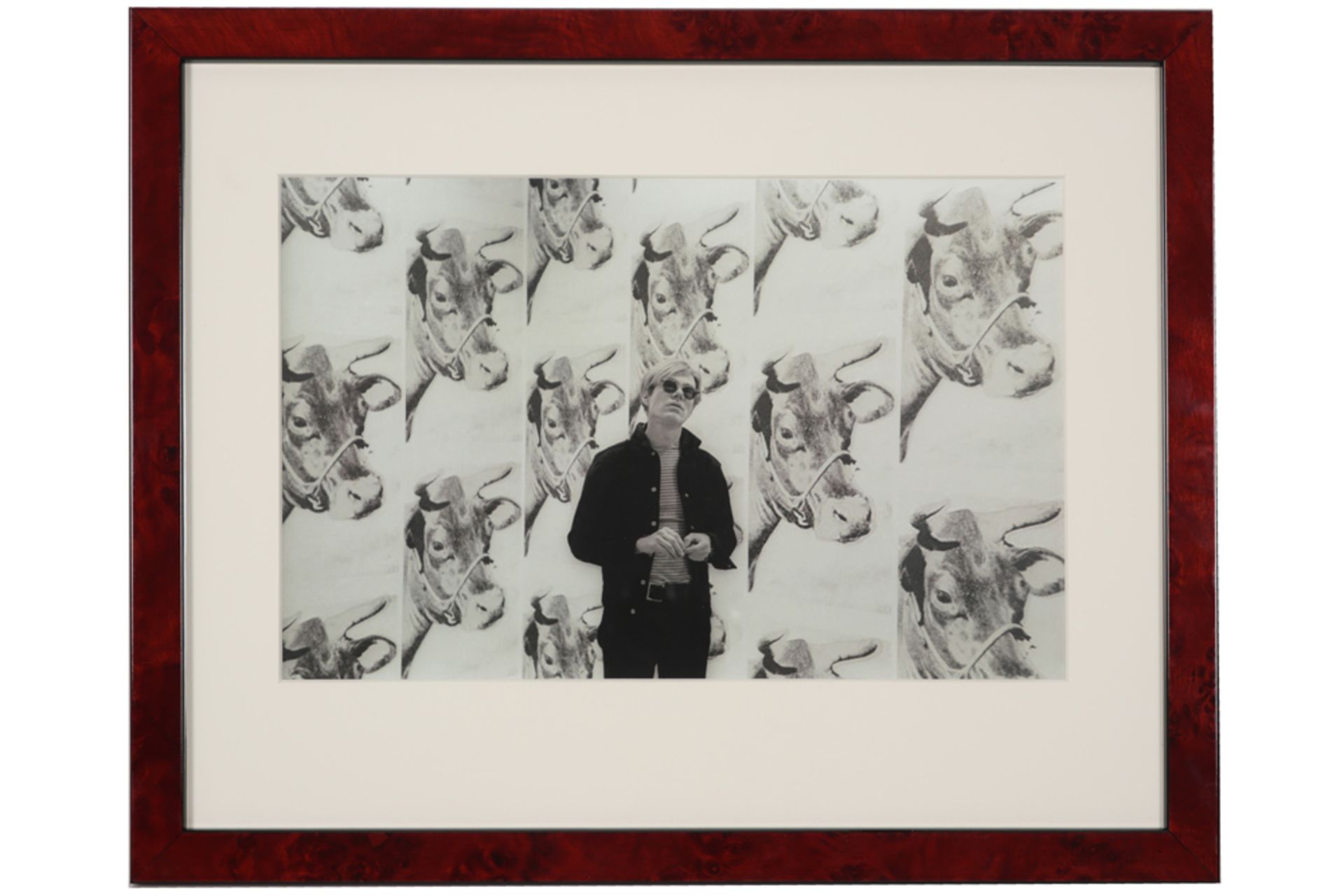 photoprint in black and white of Andy Warhol with his iconic cow wallpaper - after the original