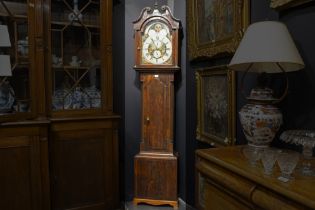 antique English clock with its case in mahogany and with a nice face with sun- and moon device ||