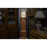 antique English clock with its case in mahogany and with a nice face with sun- and moon device ||