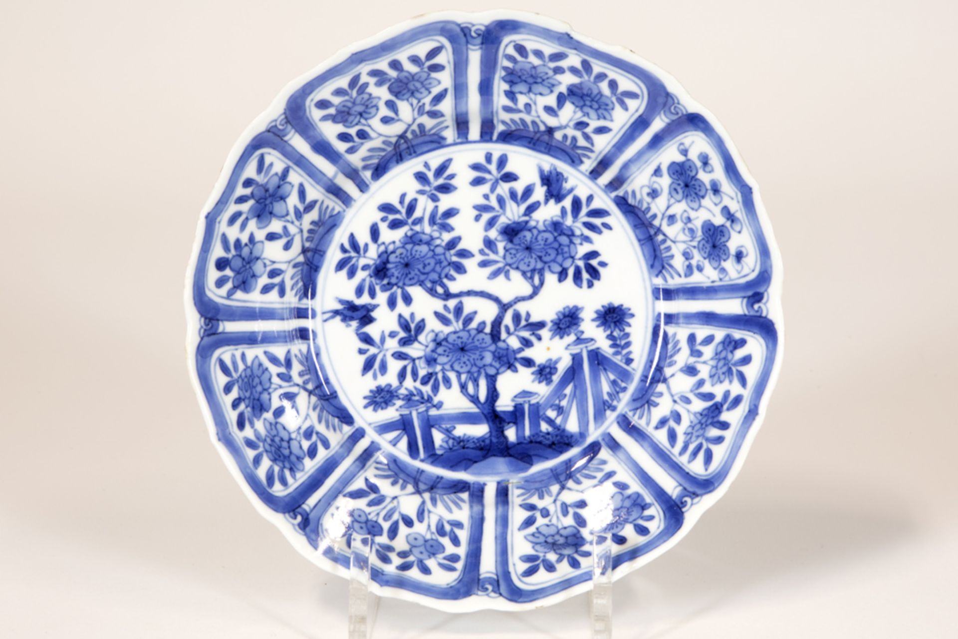 17th/18th Cent. Chinese Kang Hsi period plate in marked porcelain with a blue-white garden