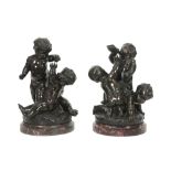 pair of antique bronze sculptures, each with three playing children - each on a base in red