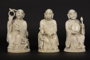 set of three antique Chinese late Qing period sculptures in ivory, each depicting a man with a