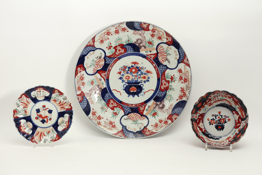 three pieces of 19th Cent. Japanese porcelain with Imari decor : a bowl, a smaller and a larger dish