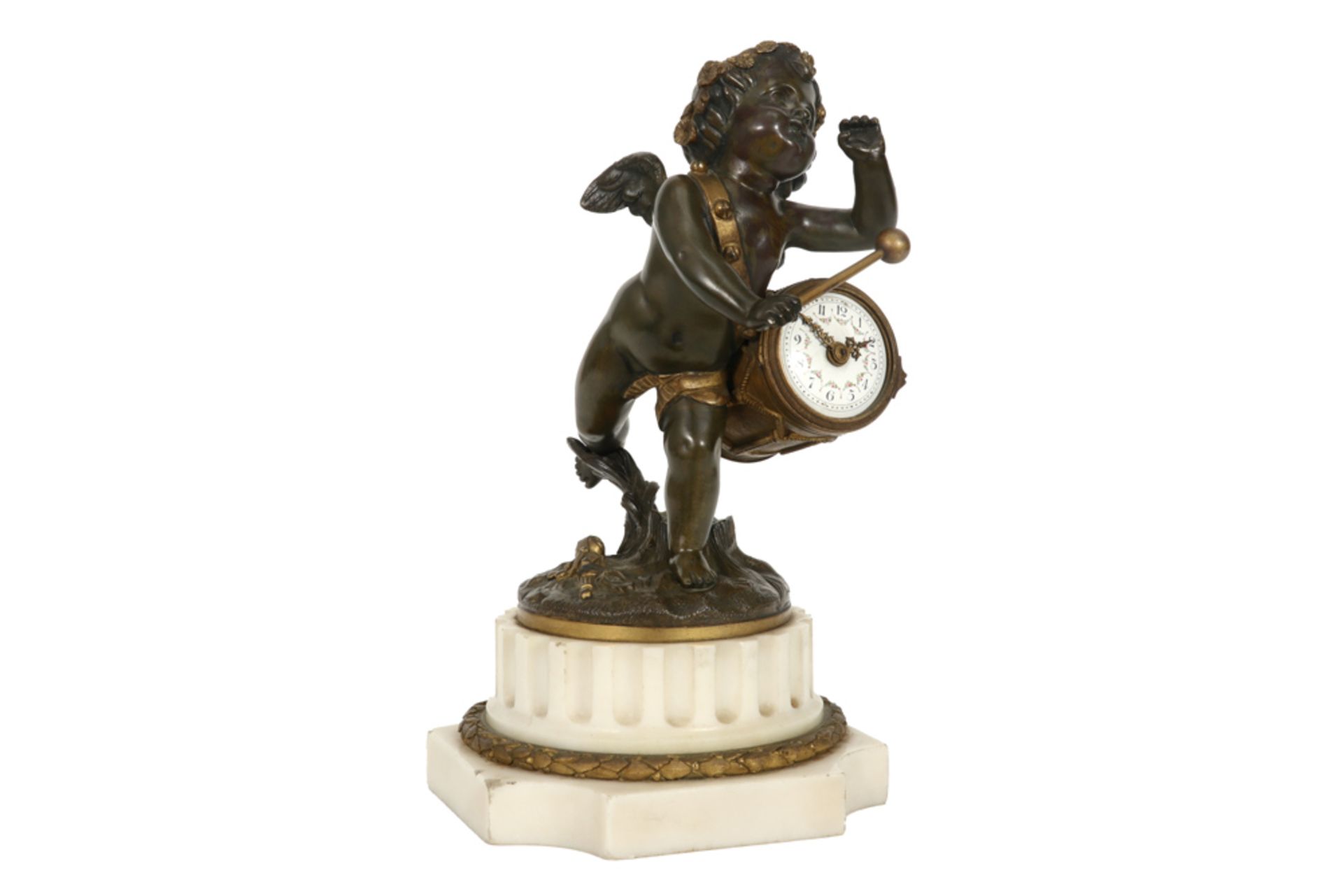 antique neoclassical sculpture with a cupid in partly decorated bronze that beats a drum, which