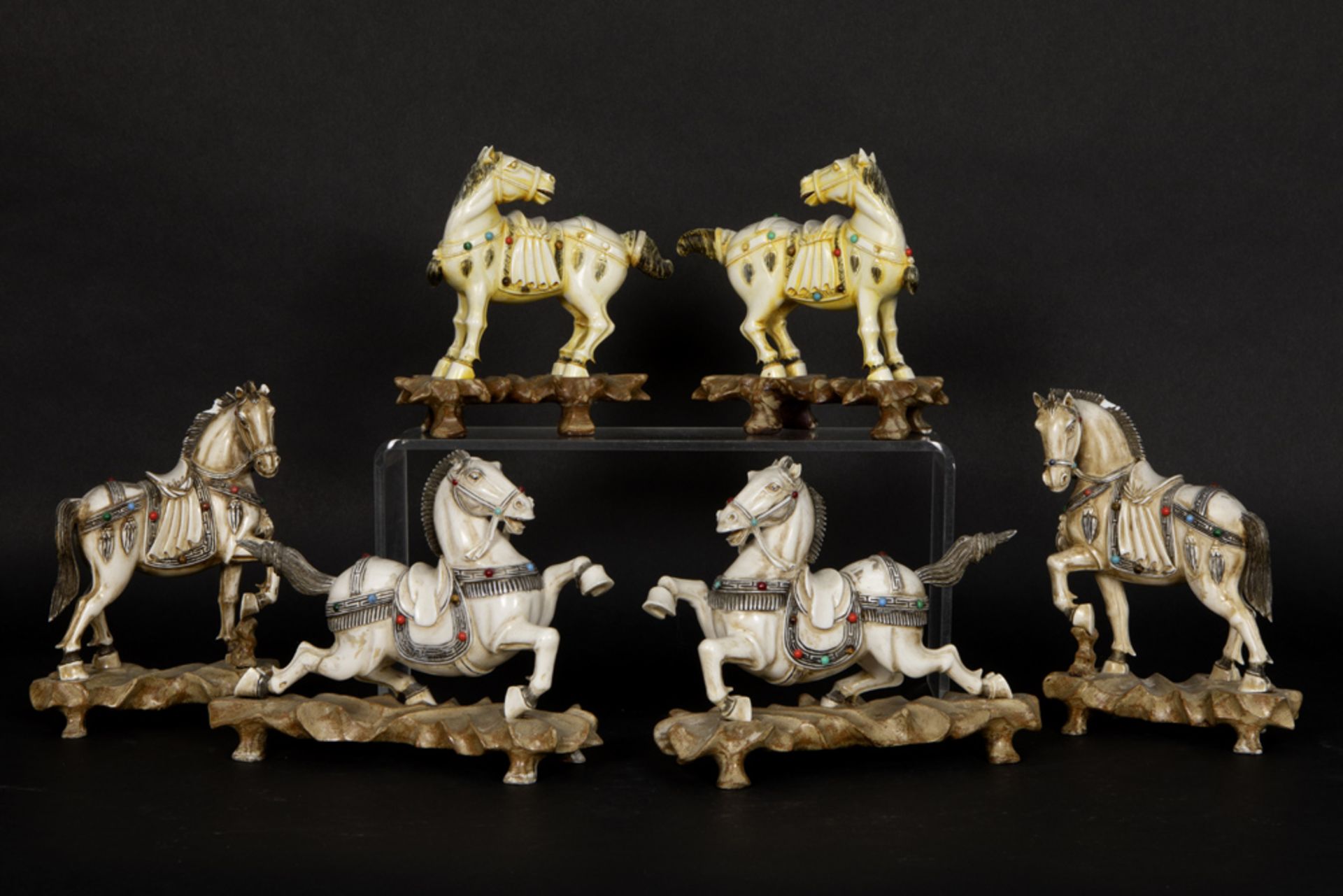 series of six antique Chinese Qing period ivory sculptures with inlay of cabochons and depicting