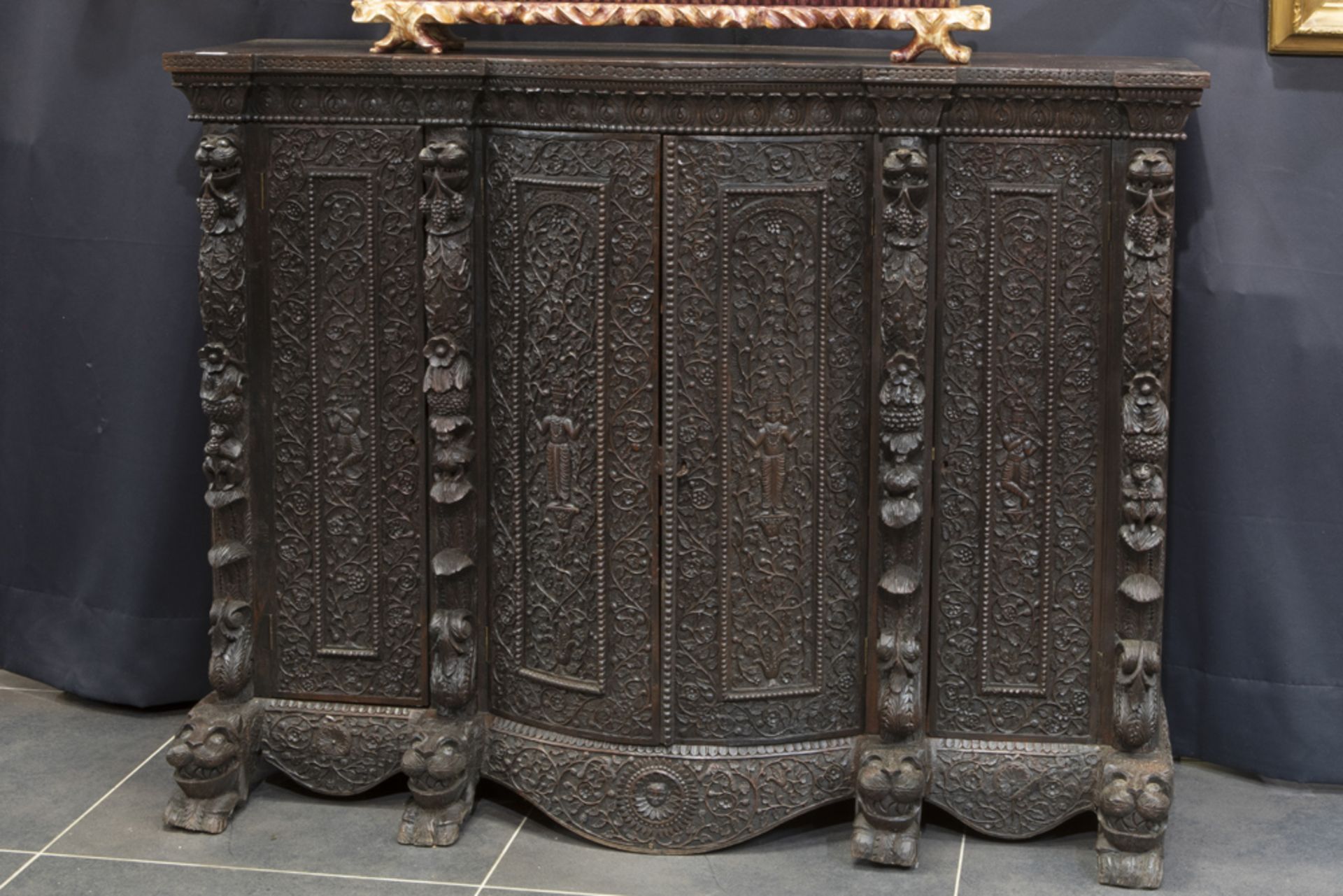antique Oriental-colonial sideboard in very heavy and very richly sculpted exotic wood (probably