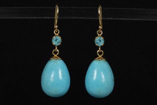 nice pair of earrings in yellow gold (18 carat) each with an apatite and a drop shaped