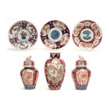 six pieces of antique Japanese Meiji period porcelain : a vase, three plates and a pair of