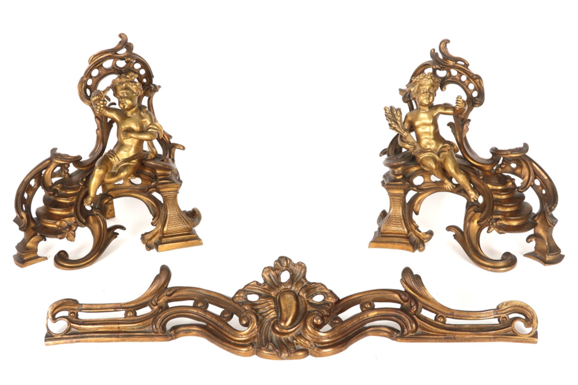 'antique' Louis XV style fire irons set in partially gilded bronze with a pair of chenets each