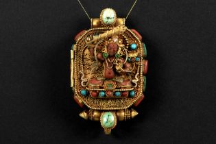 Tibeto Nepalese ghau in yellow gold on silver with turquoise, lapis lazuli and coral and with the