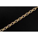 vintage Piaget style bracelet in yellow gold (18 carat) with ca 12 carat of cabochon cut sapphires