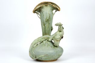 Art Nouveau vase in "Amphora" marked porcelain || Art Nouveau-vaas versierd met een pauw in