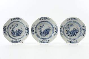 three 18th Cent. Chinese plates in porcelain with a blue-white garden decor || Set van drie