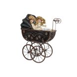two Armand Marseille marked porcelain head dolls sold with a doll's pram || ARMAND MARSEILLE twee