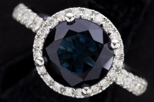 a 3,35 carat "London blue" topaz set in a ring in white gold (18 carat) with 0,47 carat of high