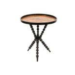 antique occasional table with a round parquetry top on a base with three crossed legs in ebonized