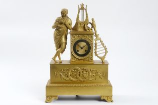 19th Cent. Empire style ormulu clock with its case in gilded bronze and with a "Pons 1823" signed