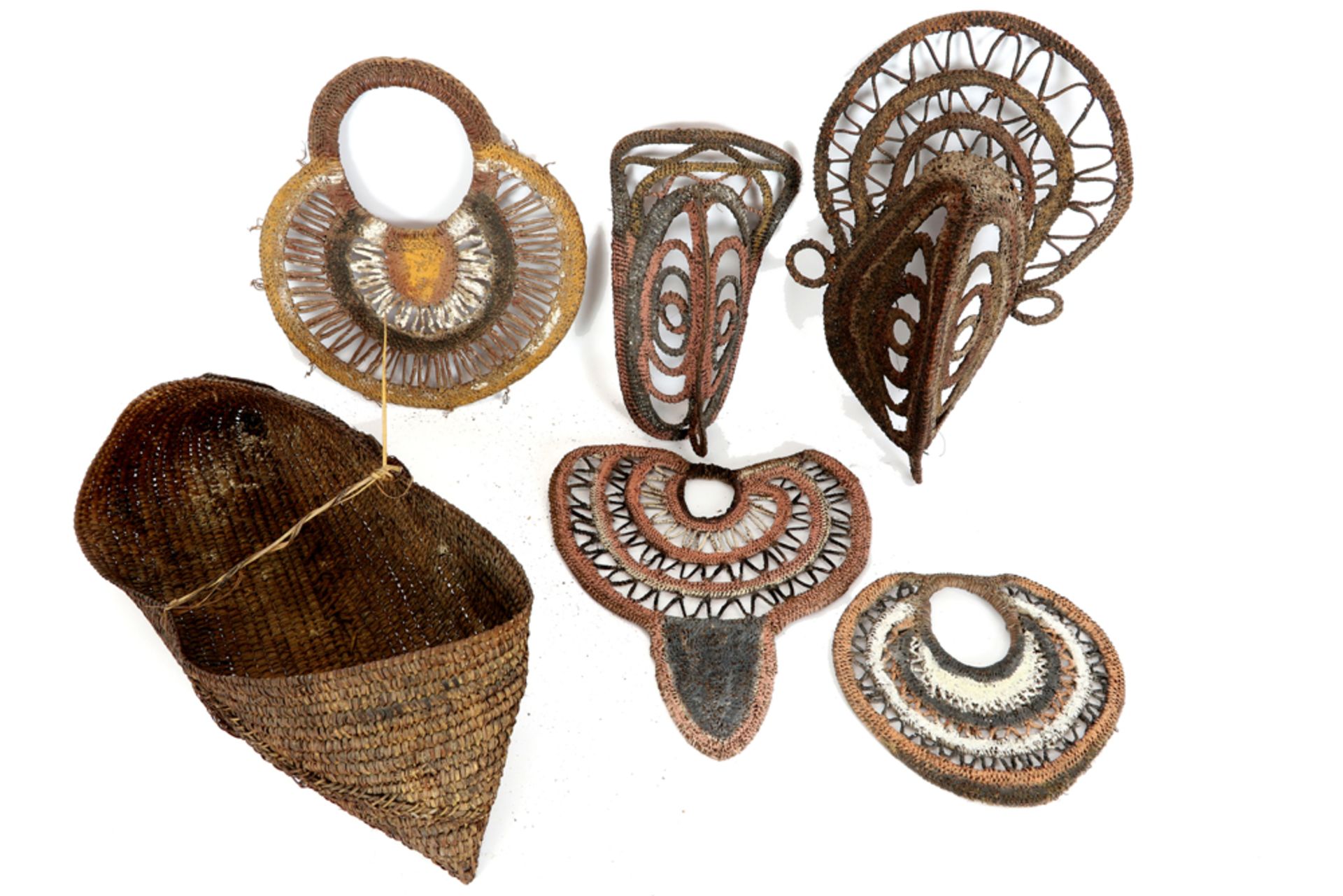 six Papua New Guinean items in basquetry : a basket, two West Sepik Yam masks and three Maprik