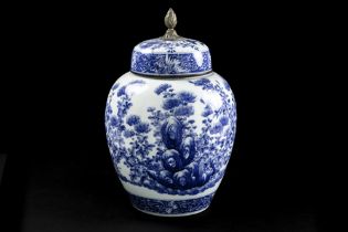antique Chinese vase with its glued lid in porcelain with a blue-white garden decor and with