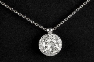 a contemporary pendant in white gold (18 carat) with a 0,97 carat quality brilliant cut diamond