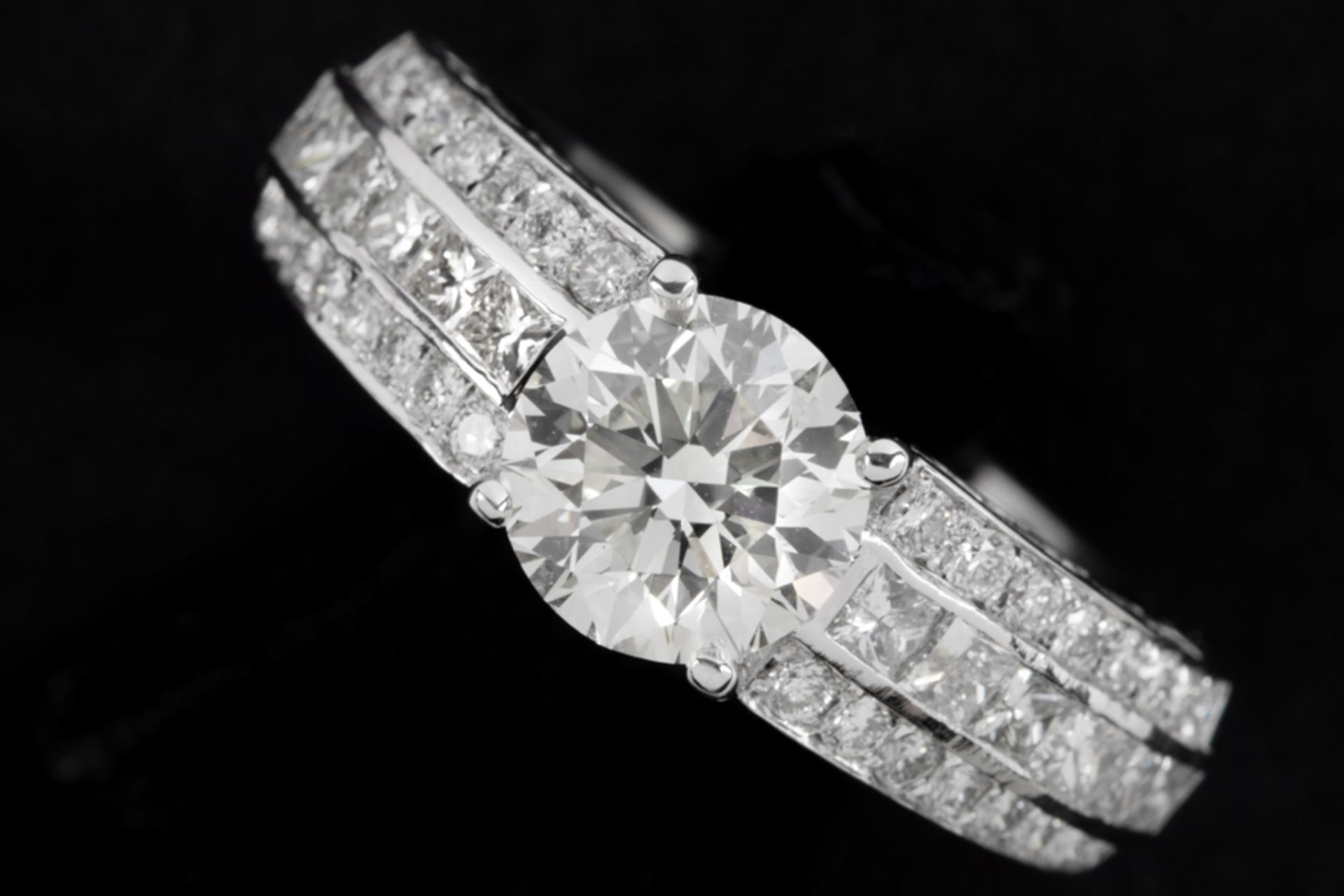 a 1,57 carat quality brilliant cut diamond set in a ring in white gold (18 carat) with circa 075