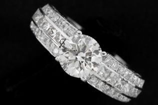 a 1,57 carat quality brilliant cut diamond set in a ring in white gold (18 carat) with circa 075