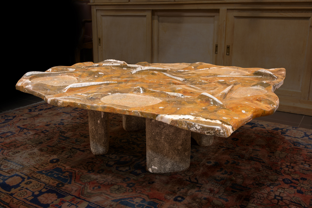 fancy table made by the Belgian sculptor Joris Maes with a top in fossil stone with ammonites ||