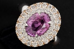 nice ring in white and pink gold (18 carat) with a 2,50 carat pink sapphire surrounded by 0,80 carat