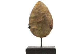 Presumably prehistoric two-sided axe head with typical characteristics of the Mousterian, named