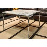 sixties' design coffee table with a marble top on a chromed base || Sixties' design salontafel met