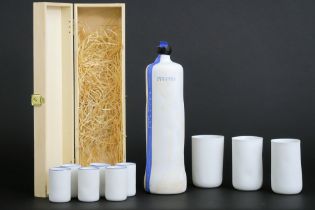 a various lot of marked Piet Stockman porcelain with a bottle and 9 glasses || STOCKMANS PIET (°