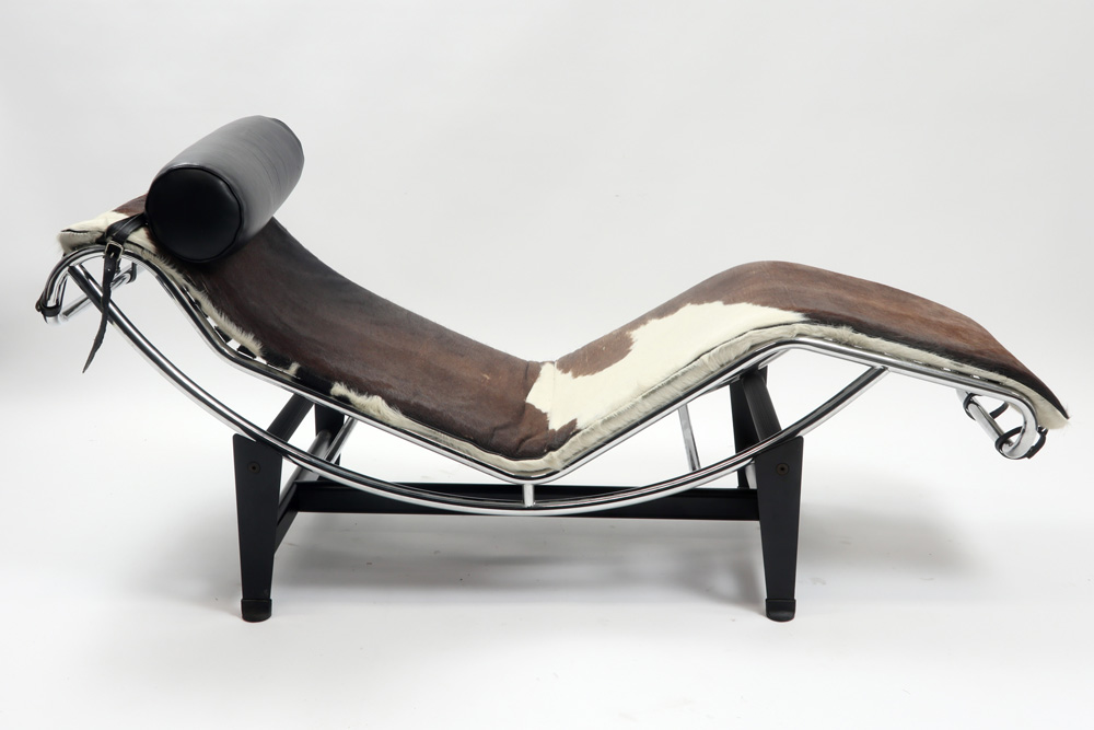 20th Cent. lounge chair after Le Corbusier's "LC4" design in partially chromed metal and with