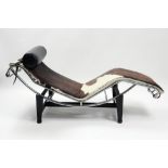 20th Cent. lounge chair after Le Corbusier's "LC4" design in partially chromed metal and with