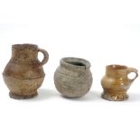 three pieces of earthenware from Raeren to be dated between 1300 and 1500 || Lot van drie stuks