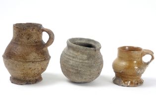 three pieces of earthenware from Raeren to be dated between 1300 and 1500 || Lot van drie stuks