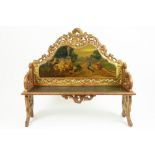 small antique Louis XV style bench in gilded and sculpted wood and with a panel with a painting of