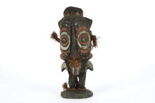 Papua New Guinean Middle Sepik sculpture depicting a ghost/spirit or god in wood with pigments ||