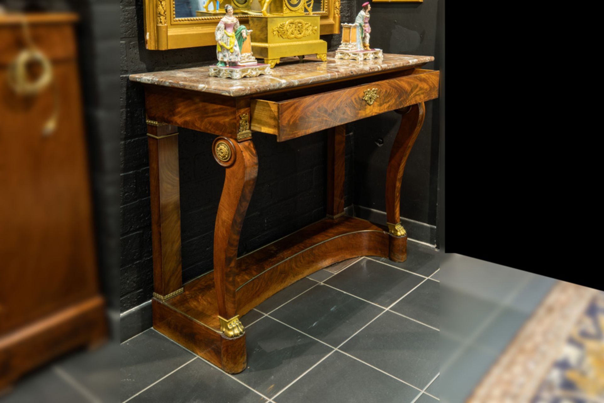 early 19th Cent. Empire style console in mahogany with ornaments in gilded bronze - with a drawer