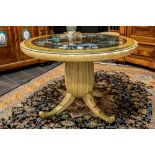 quite special, presumably Italian Art Deco table in painted wood and gilded bronze with a round