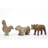 three Chinese Han period tomb figures in the shape of horoscope animals (cock, god and ox) in