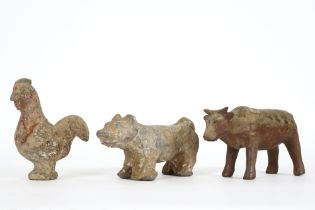 three Chinese Han period tomb figures in the shape of horoscope animals (cock, god and ox) in