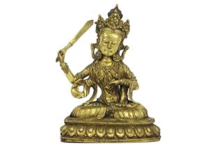 antique Bhutanese sculpture (with typical Bhutanese large head) in guilded bronze inlaid with