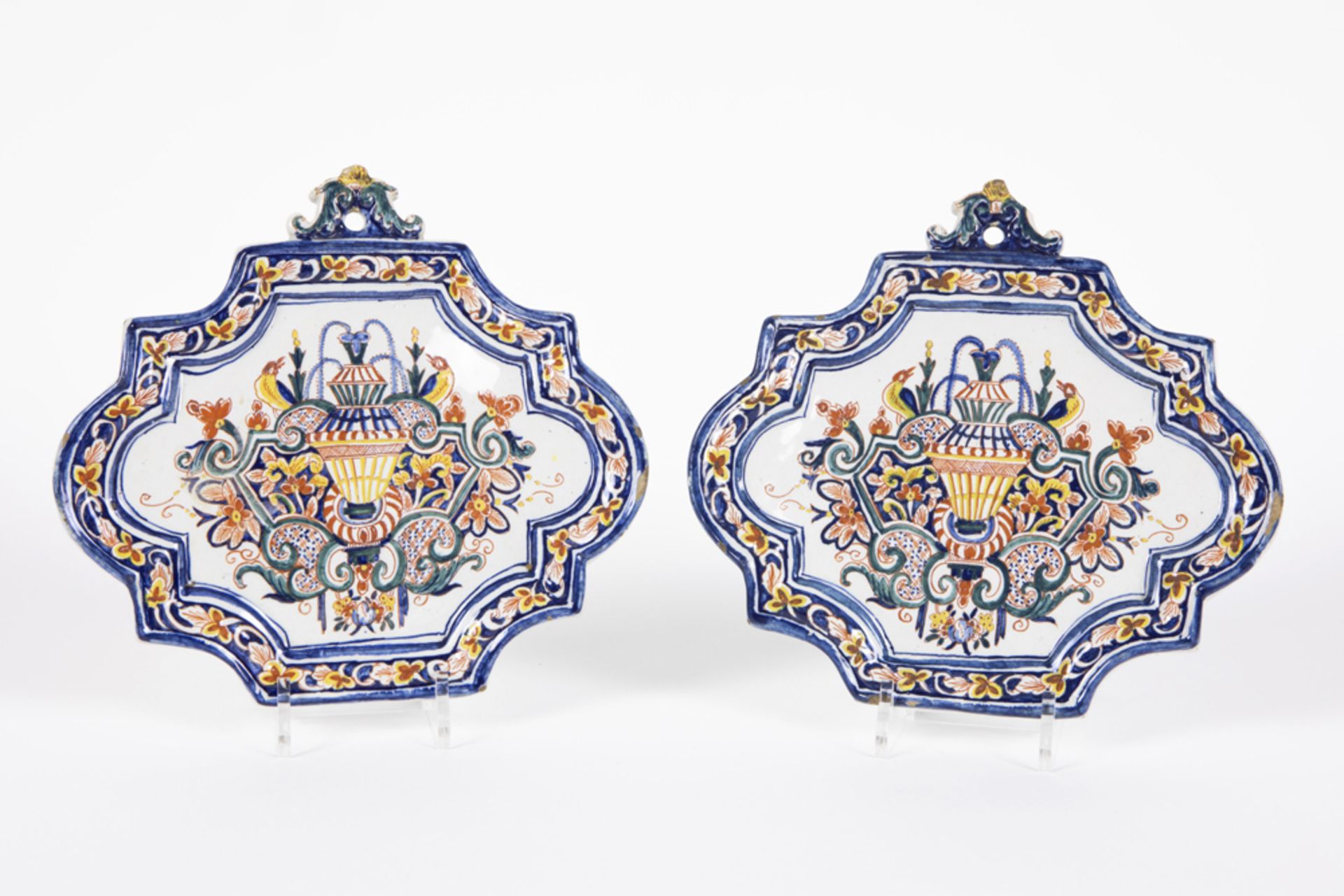 pair of presumably 18th Cent plaques in ceramic from Delft, marked IVRN 1744, with a baroque style