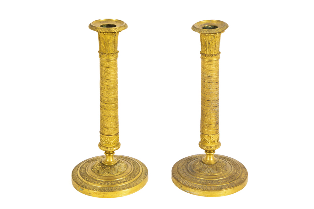 pair of antique presumably French Charles X period candlesticks in gilded metal || Paar antieke