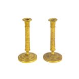 pair of antique presumably French Charles X period candlesticks in gilded metal || Paar antieke